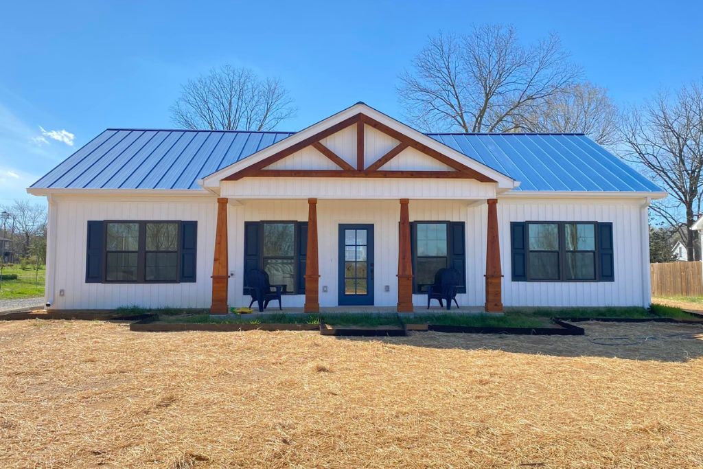 Custom Slab Home (Metal Roof + Cedar Columns + Truss Detail)